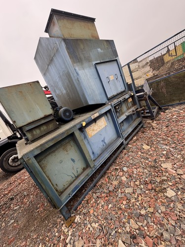 Waste skip compactor hook